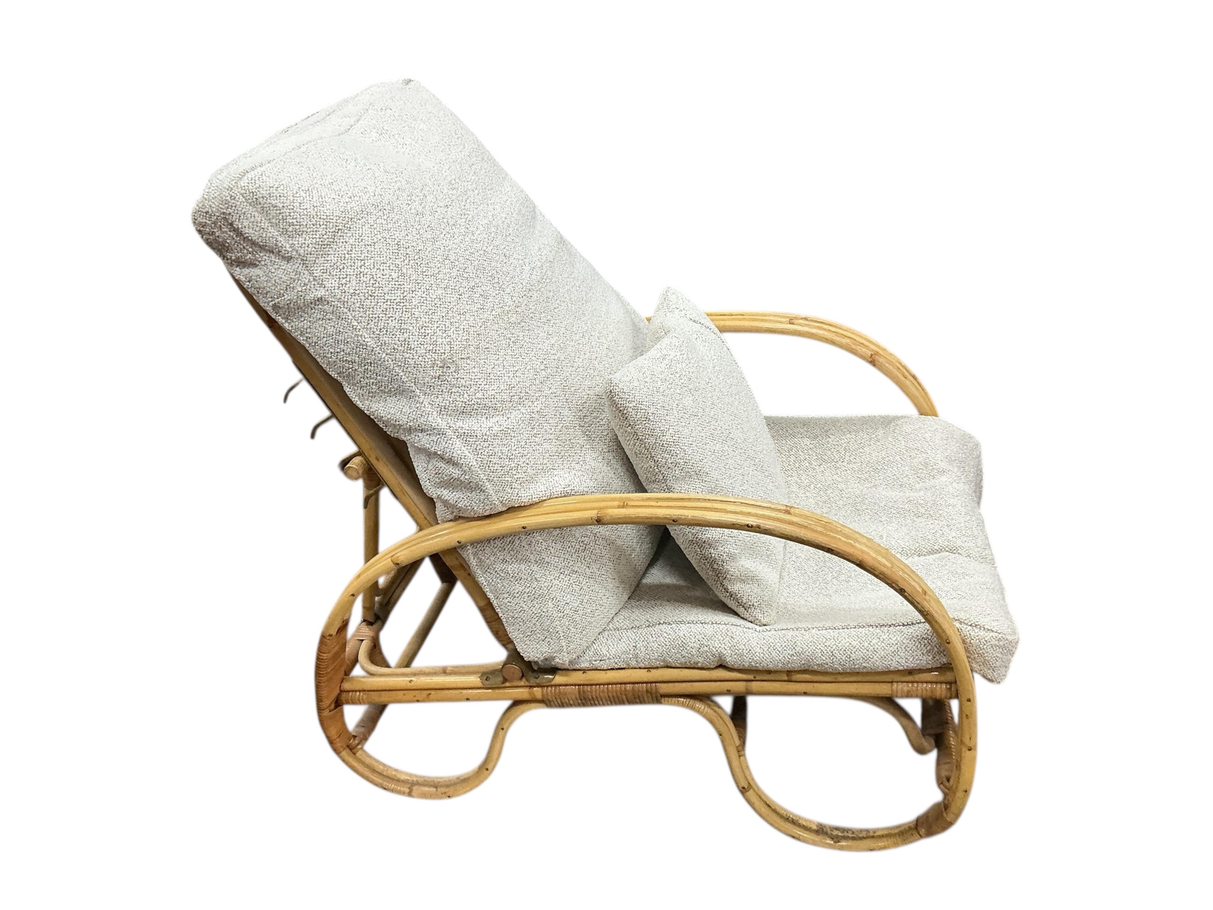 A mid century Angrave’s of Leicester “Invincible” bamboo suite comprising a pair of chairs, one brass mounted and reclining, a pair of matching footstools and a circular glass top occasional table, all with recently reup